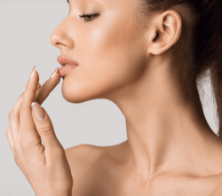A photo of a woman staring off to her right side. She was wary of the question of: "are dermal fillers safe" but she had that answered and proceeded to get dermal fillers.